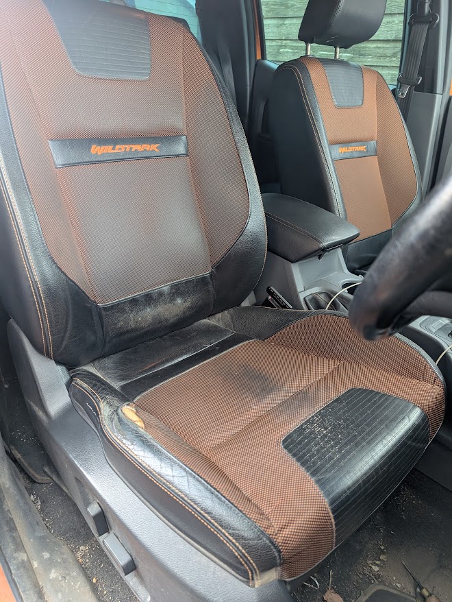Ford Wildtrak driver's seat before repair with a torn outer bolster